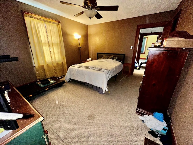 bedroom featuring ceiling fan and carpet flooring