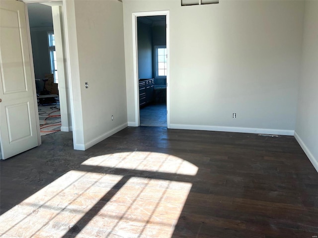 unfurnished room featuring dark hardwood / wood-style floors