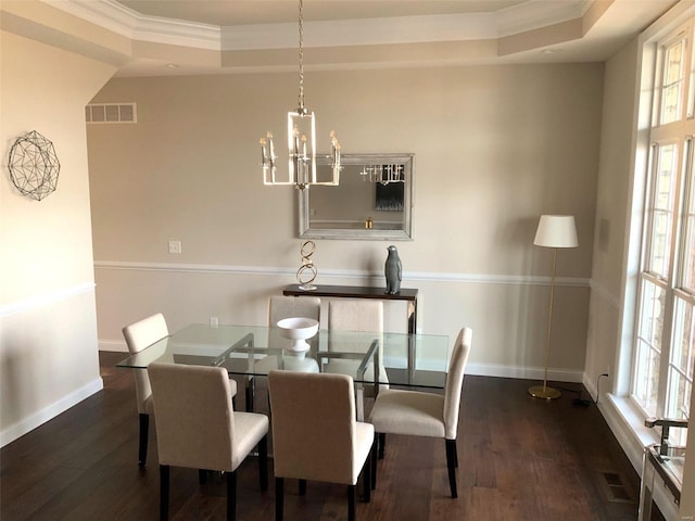 dining space featuring plenty of natural light, ornamental molding, and dark wood-type flooring