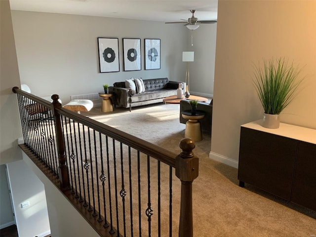 carpeted living room featuring ceiling fan