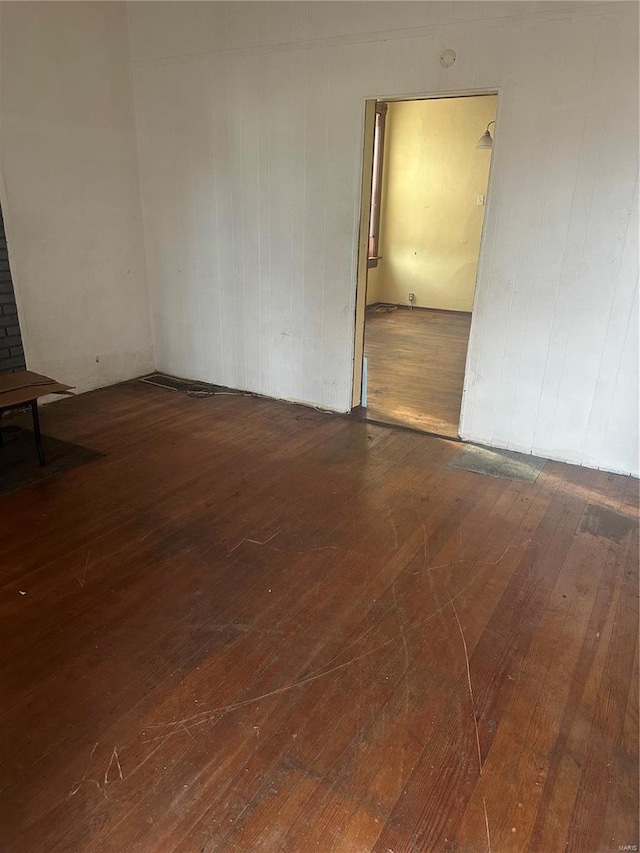 empty room featuring dark wood-type flooring