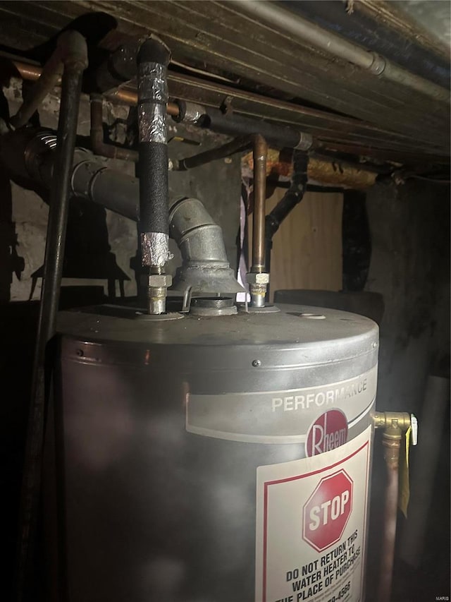 utility room featuring gas water heater