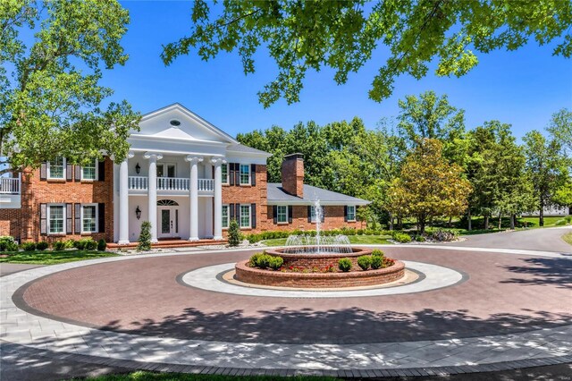 view of front of house with a balcony