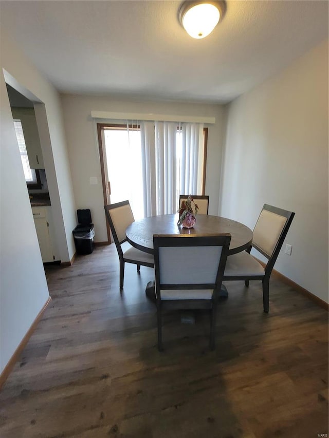 dining area with dark wood-type flooring