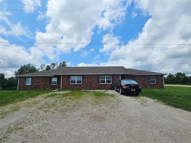 ranch-style house with a front yard