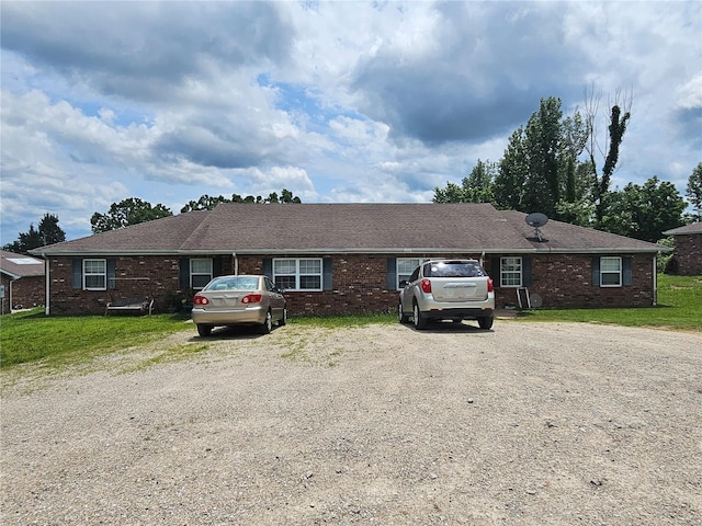 ranch-style home with a front lawn