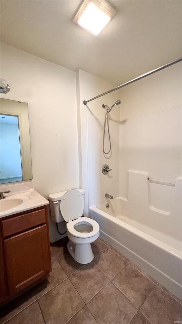 full bathroom featuring tile floors,  shower combination, toilet, and vanity