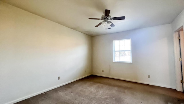 carpeted spare room with ceiling fan