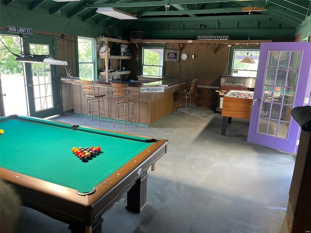 playroom with billiards, french doors, concrete floors, and vaulted ceiling