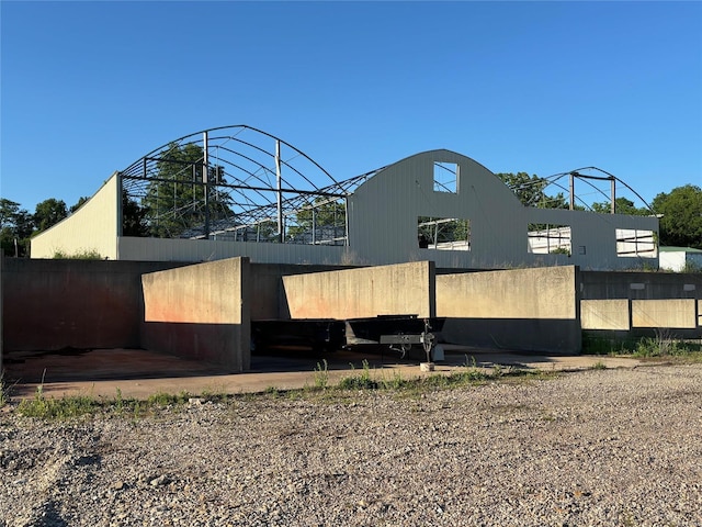 view of side of home featuring fence