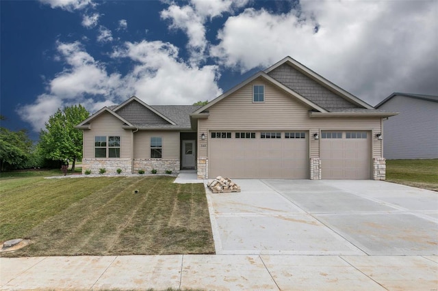 craftsman-style home featuring a garage and a front yard