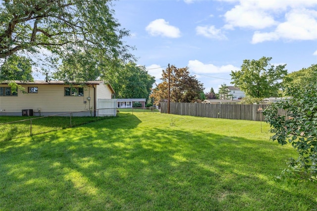 view of yard with central AC