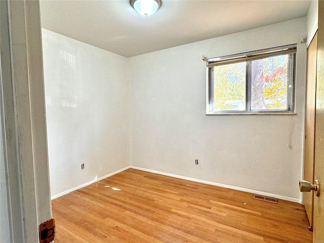 unfurnished room featuring light wood-type flooring