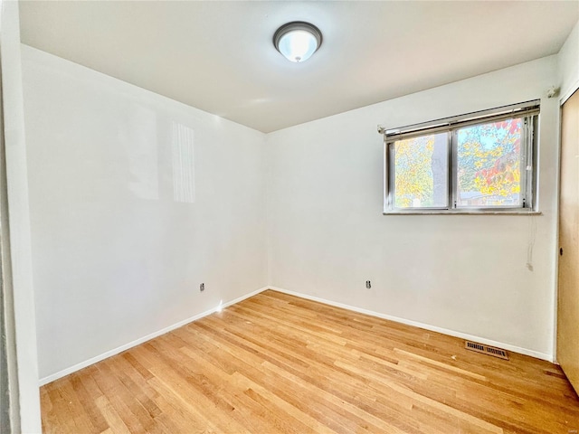 empty room featuring hardwood / wood-style flooring