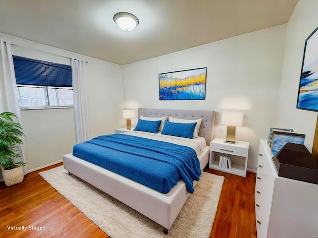 bedroom featuring wood-type flooring