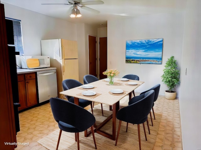 dining space featuring ceiling fan