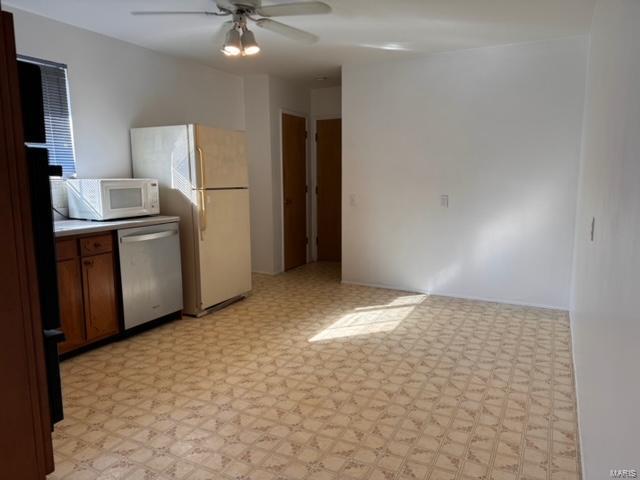 kitchen with white appliances and ceiling fan