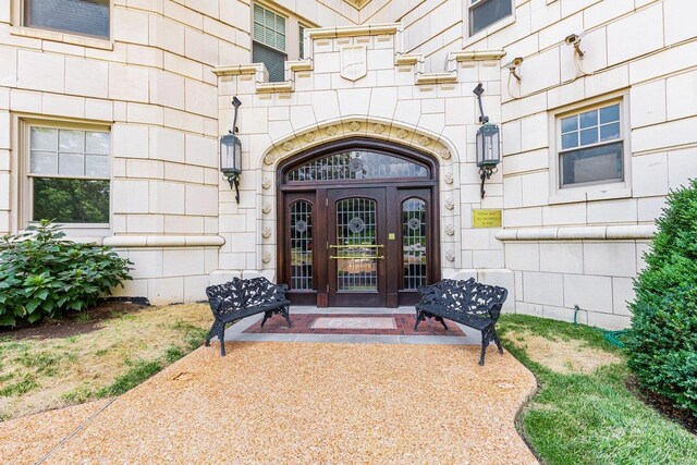 property entrance featuring french doors