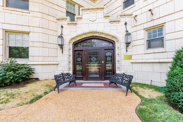 doorway to property featuring stone siding