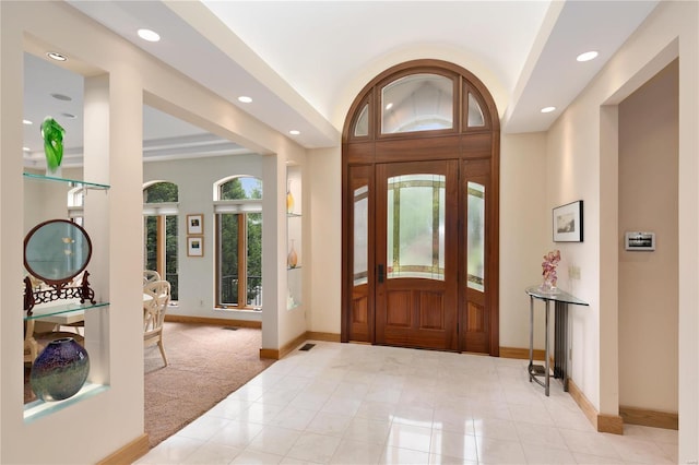 entryway with light colored carpet