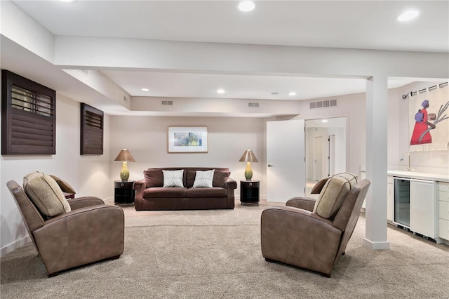 carpeted living room featuring bar