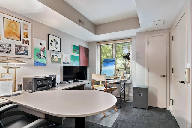 home office with dark colored carpet