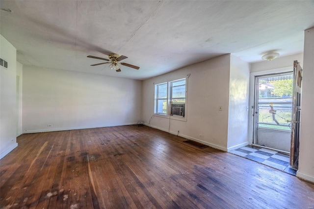 spare room with ceiling fan and dark hardwood / wood-style flooring