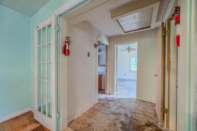 hallway featuring baseboards