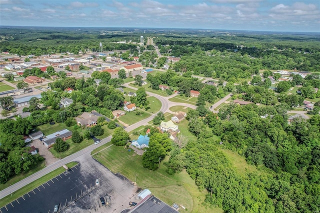 drone / aerial view featuring a forest view