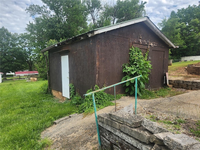 view of home's exterior with a storage shed