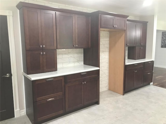 kitchen featuring tasteful backsplash and light countertops