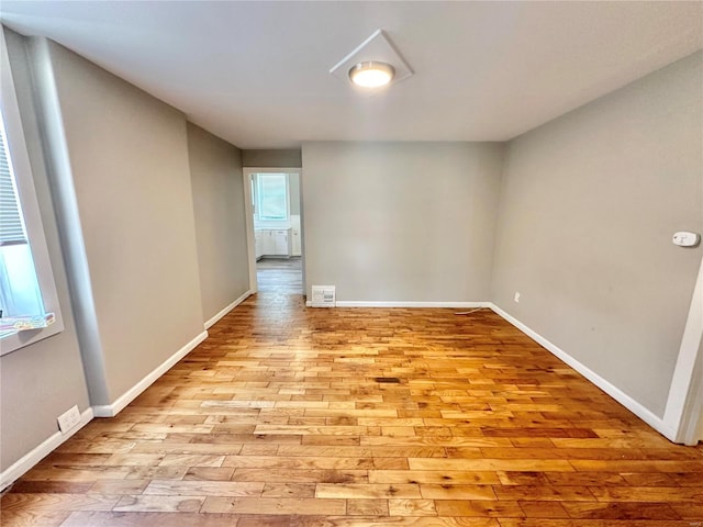 spare room featuring light wood-type flooring