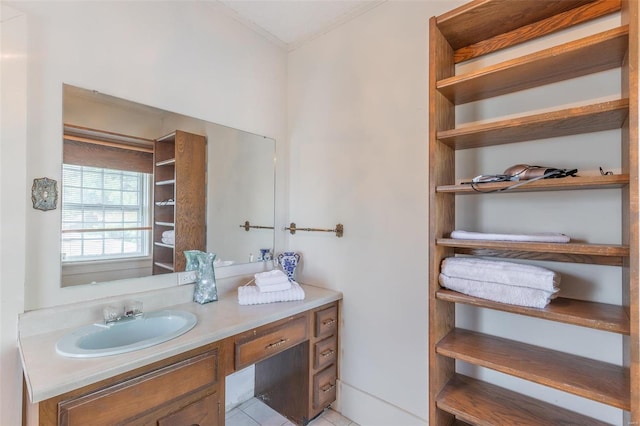 bathroom featuring tile patterned flooring and vanity