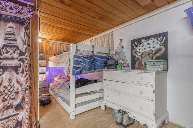 bedroom with crown molding and wooden ceiling