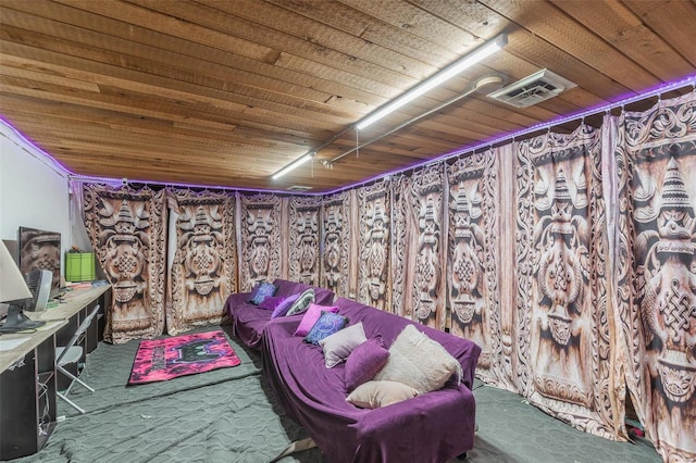 interior space featuring carpet floors and wood ceiling