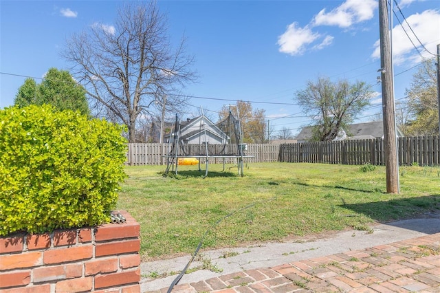 view of yard with a trampoline