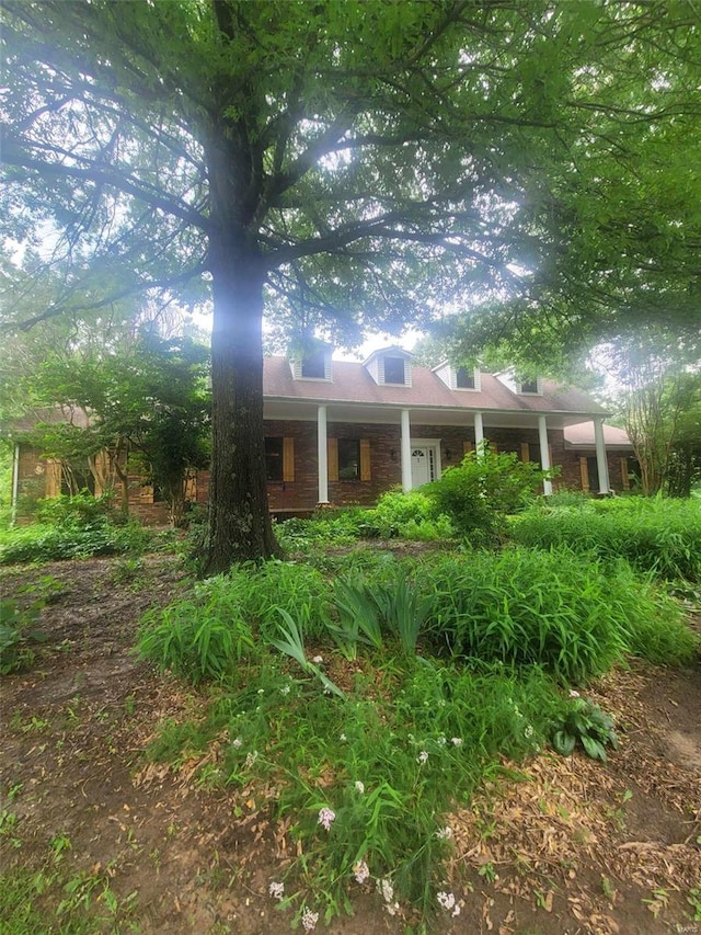 exterior space with brick siding