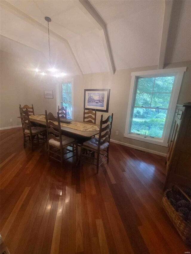 dining area featuring a wealth of natural light, dark wood-type flooring, and vaulted ceiling