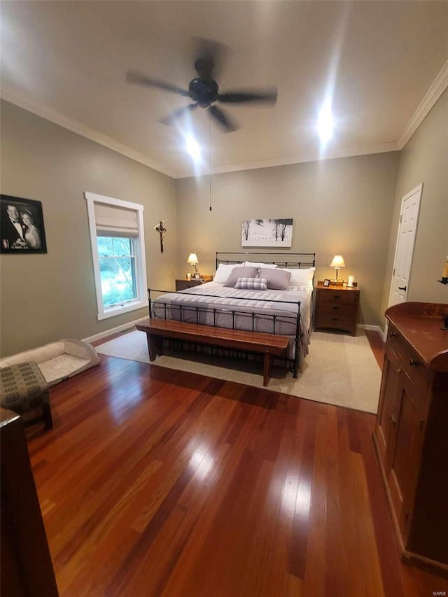 bedroom with ornamental molding, ceiling fan, and light hardwood / wood-style flooring