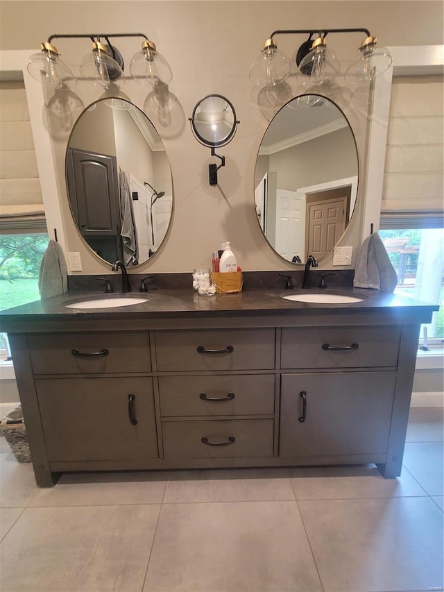 bathroom with dual bowl vanity, tile flooring, and crown molding