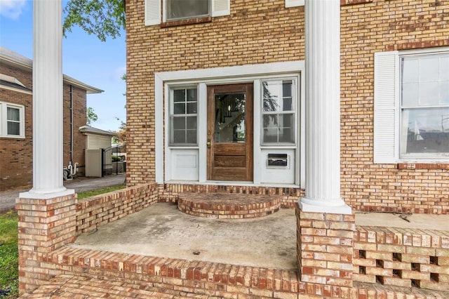 view of exterior entry featuring a porch