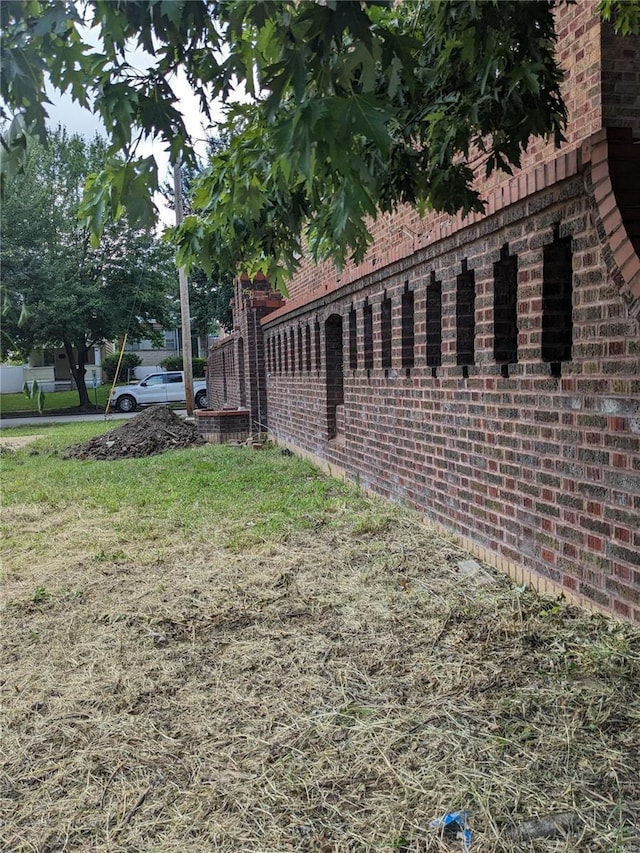 view of property exterior with a yard