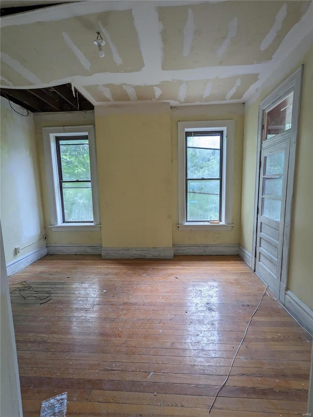 spare room with light wood-type flooring