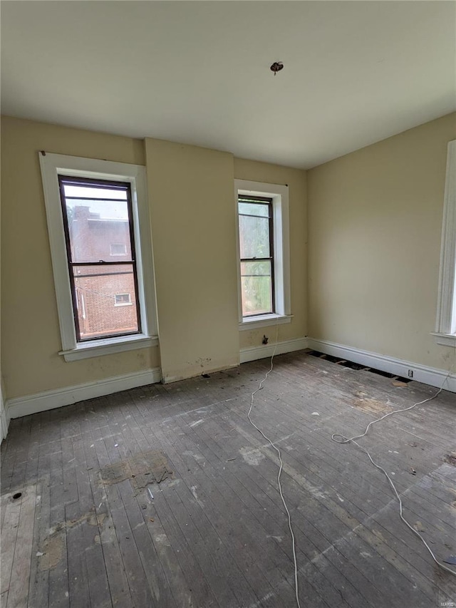 empty room featuring wood-type flooring