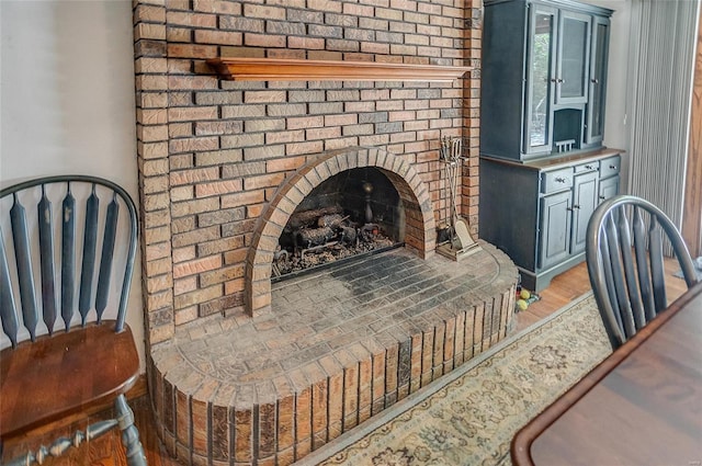 living room featuring light hardwood / wood-style floors and a fireplace