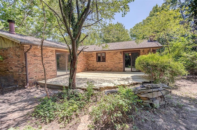 back of property featuring a patio area