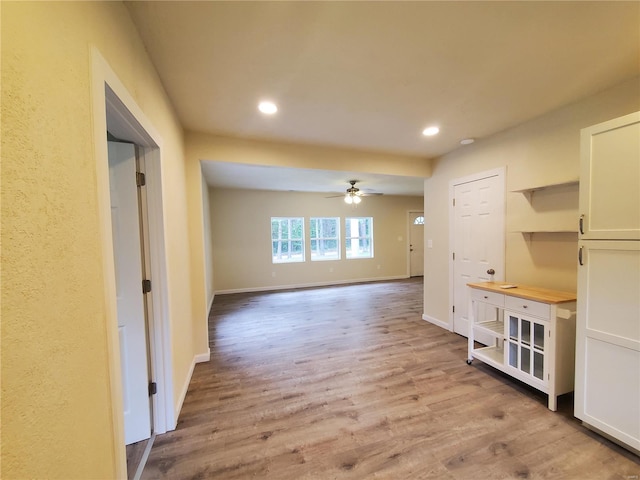 empty room featuring ceiling fan and hardwood / wood-style flooring