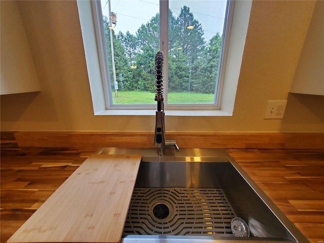 details with wood-type flooring and wood counters