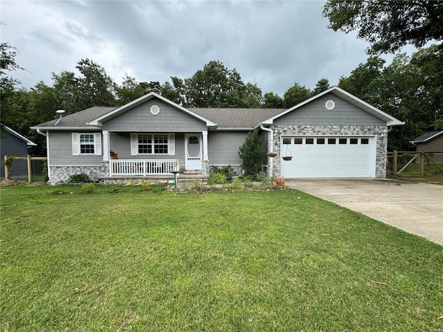 ranch-style home featuring a garage, a porch, and a front yard