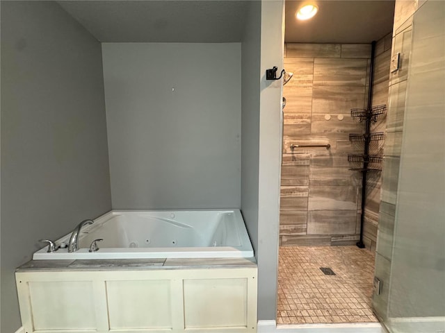 bathroom with separate shower and tub